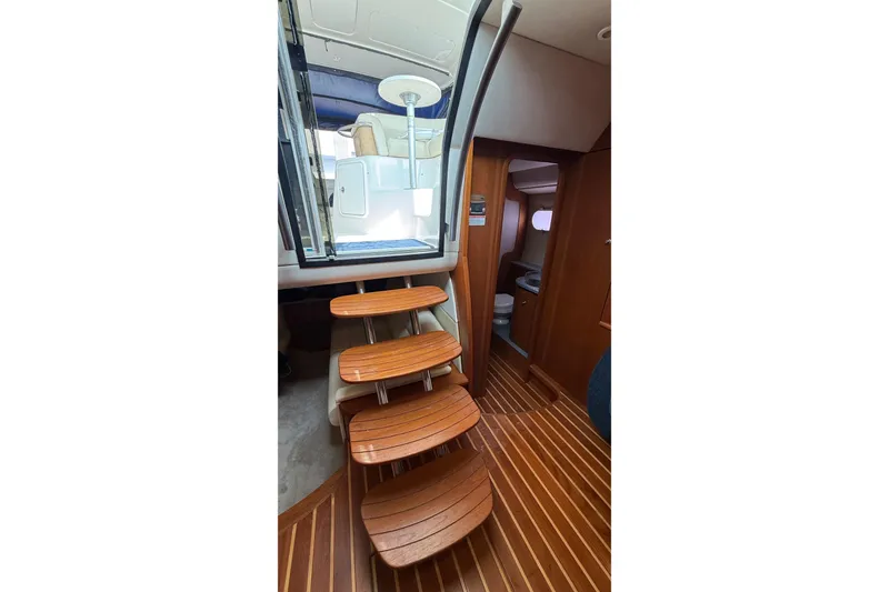 Slide: The Image of 2007 Tiara Yachts 3900 Sovran interior with wooden steps and cabin view. - 55