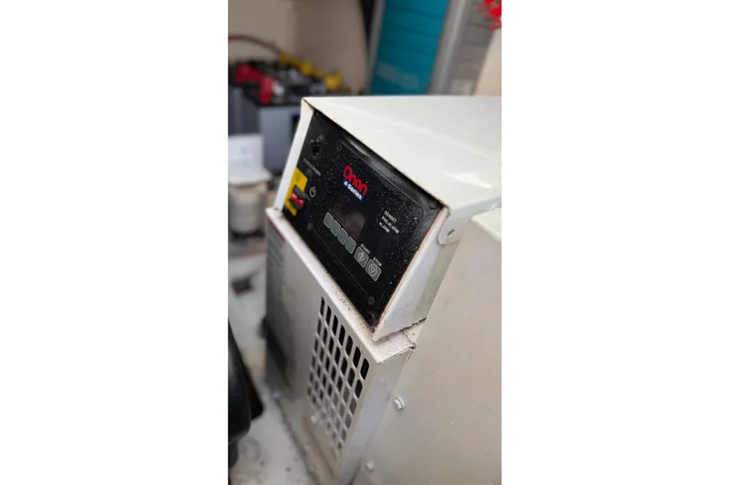 Slide: The Image of Onan generator control panel on a 2007 Tiara Yachts 3900 Sovran. - 59