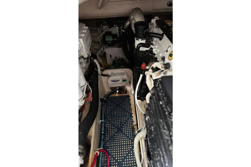 Slide: The Image of Engine compartment of a 2007 Tiara Yachts 3900 Sovran, showcasing mechanical components. - 60