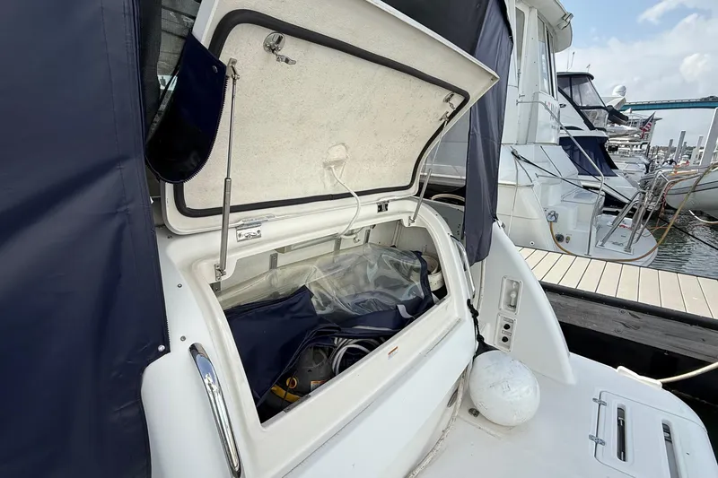 Slide: The Image of 2007 Tiara Yachts 3900 Sovran storage compartment open at marina dock. - 7