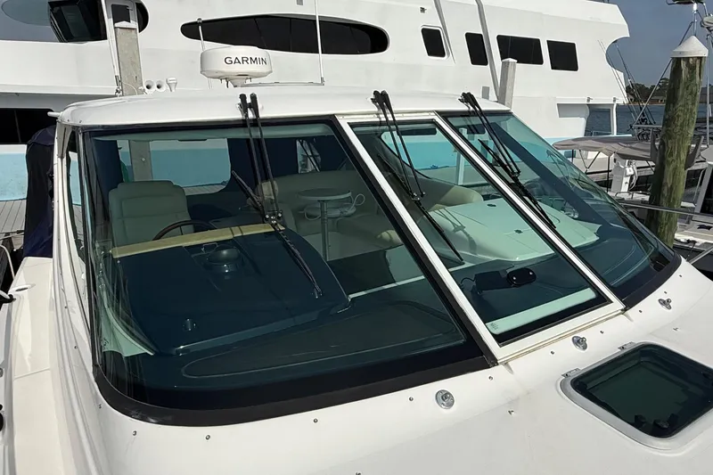 Slide: The Image of 2007 Tiara Yachts 3900 Sovran with Garmin equipment, docked at a marina. - 9