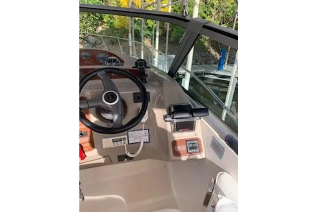 Slide: The Image of Cockpit of 2000 Maxum 3300 SCR boat with steering wheel and controls. - 19