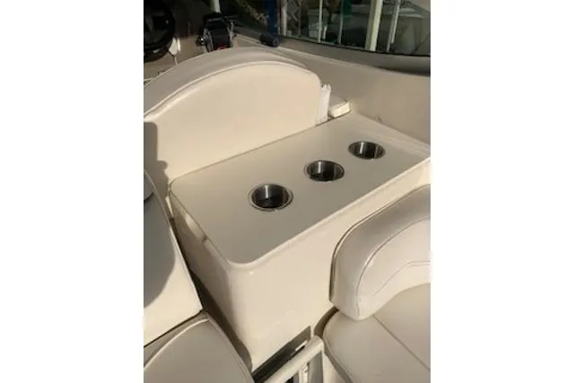Slide: The Image of 2000 Maxum 3300 SCR boat interior with cup holders and seating area. - 22