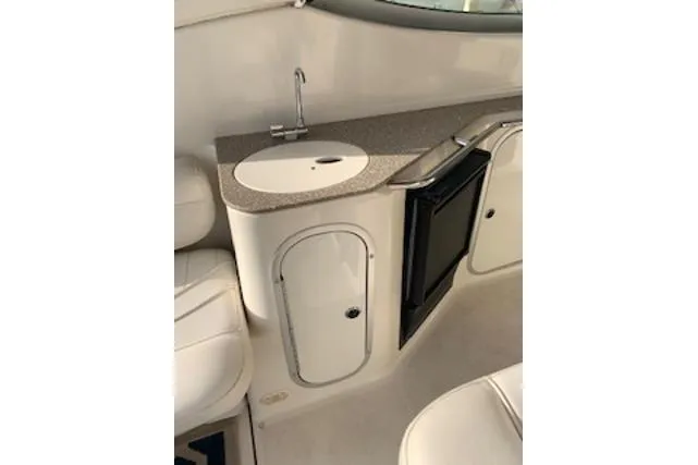 Slide: The Image of Interior of 2000 Maxum 3300 SCR boat with sink and mini fridge. - 23
