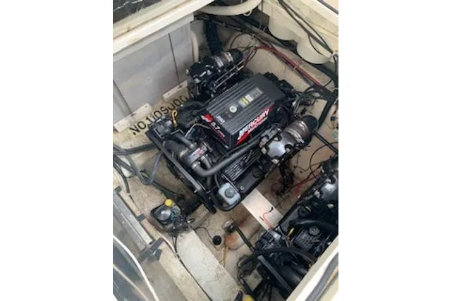 Slide: The Image of Engine compartment of a 2000 Maxum 3300 SCR boat, featuring a Mercury engine. - 24