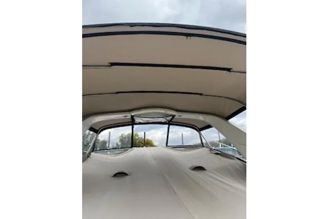 Slide: The Image of 2000 Maxum 3300 SCR boat interior with beige canopy and windows. - 35