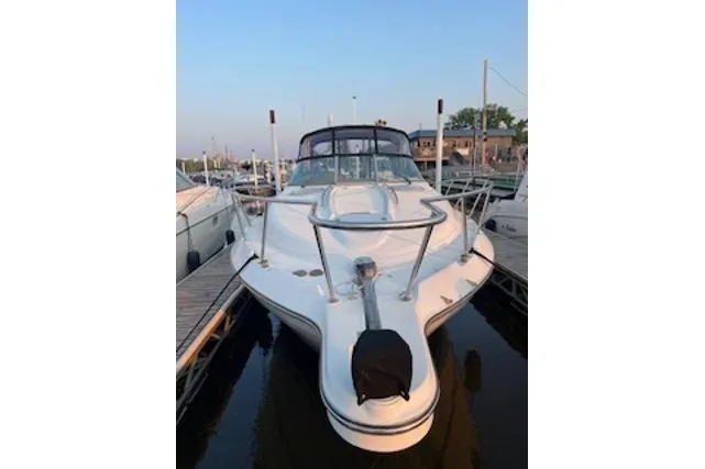 Slide: The Image of 2000 Maxum 3300 SCR boat docked at marina, front view. - 37