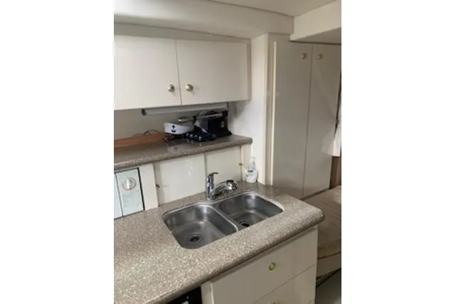 Slide: The Image of 2000 Maxum 3300 SCR yacht kitchen with dual sink and cabinets. - 39