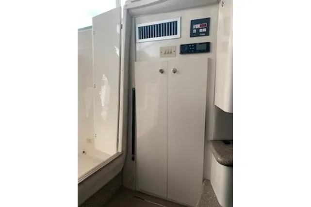 Slide: The Image of Interior of 2000 Maxum 3300 SCR boat showing control panel and storage. - 6