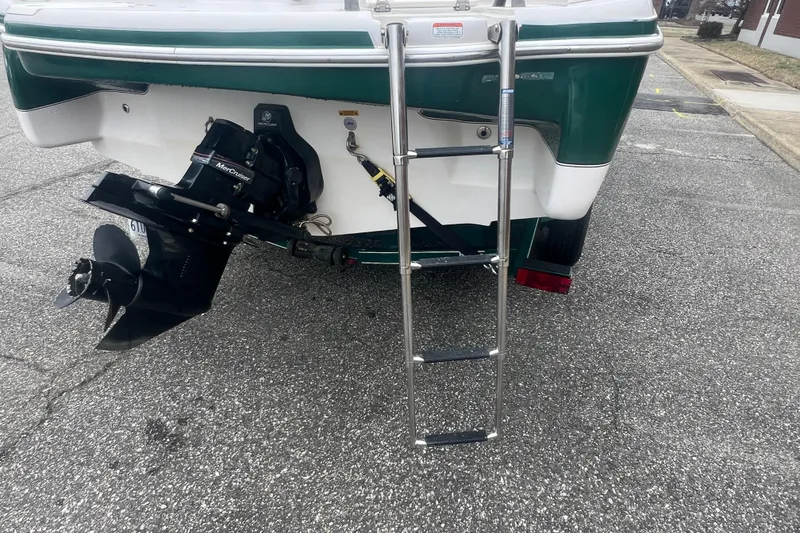 Slide: The Image of Rear view of a 2005 Tahoe 234 boat with ladder and propeller. - 11