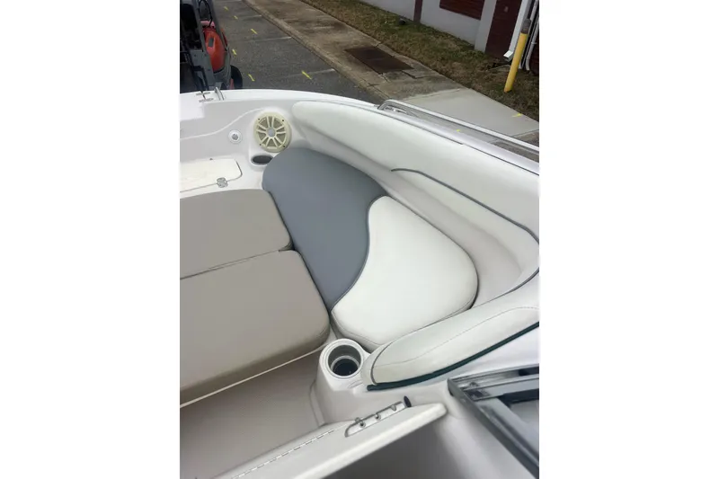Slide: The Image of 2005 Tahoe 234 boat interior with cushioned seating and cup holder. - 20