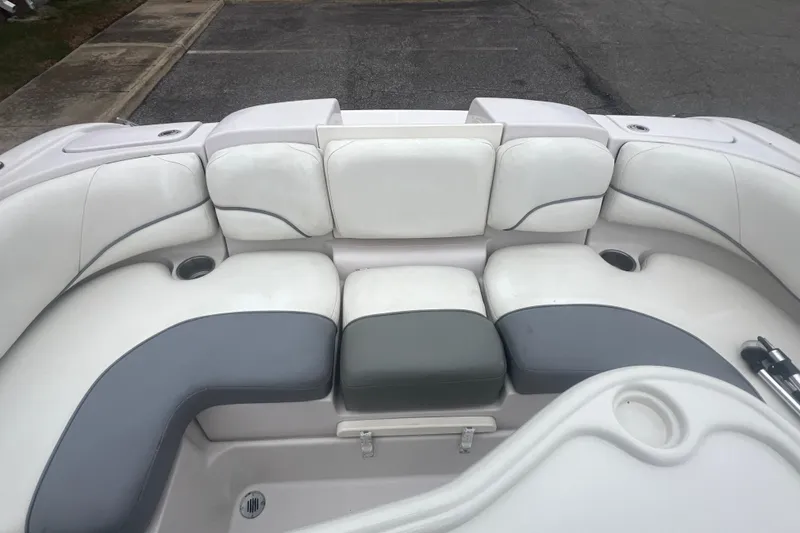 Slide: The Image of 2005 Tahoe 234 boat interior with white and gray seating arrangement. - 29