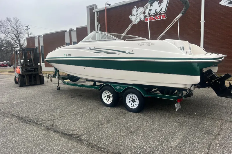 Slide: The Image of 2005 Tahoe 234 boat on trailer outside HM Boats building. - 3