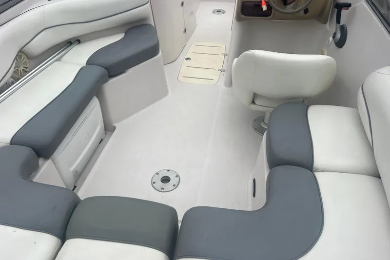 Slide: The Image of 2005 Tahoe 234 boat interior with gray and white seating arrangement. - 38