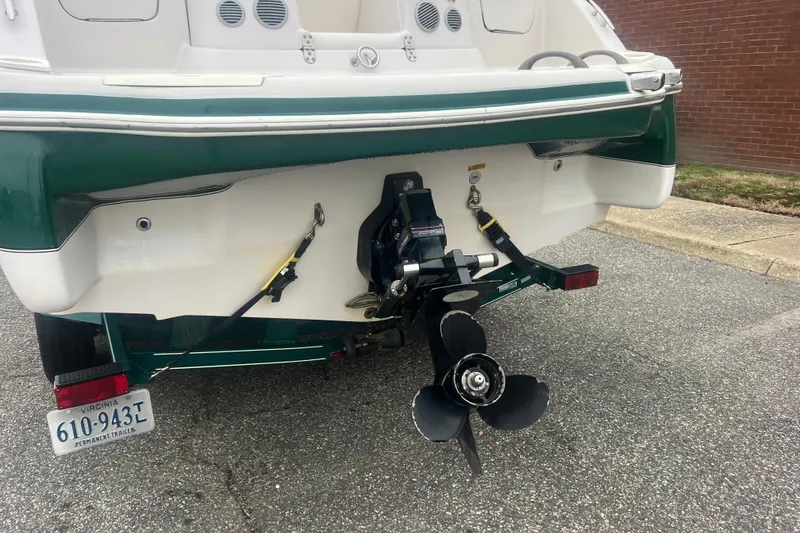 Slide: The Image of Rear view of a 2005 Tahoe 234 boat with propeller and trailer. - 5