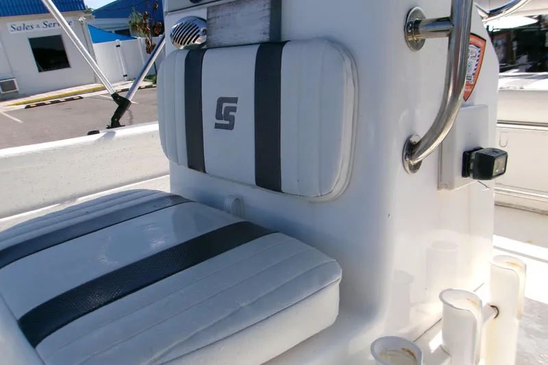 Slide: The Image of 2012 Carolina Skiff JVX16CC boat seat with logo and console details. - 4