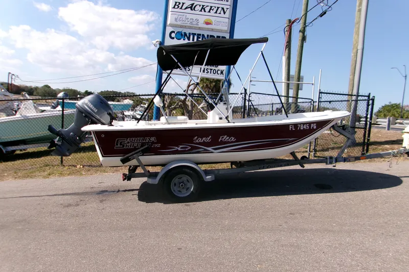Slide: The Image of 2012 Carolina Skiff JVX16CC boat on trailer with Yamaha outboard motor. - 8