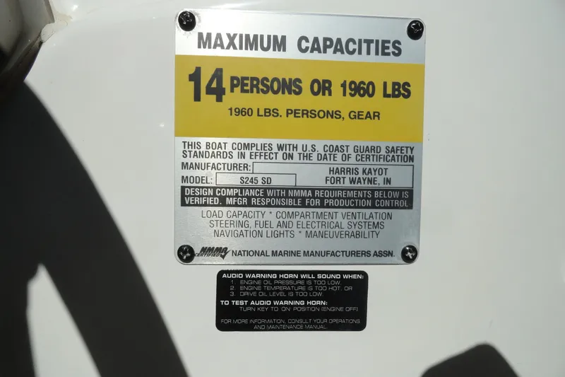 Slide: The Image of 2005 Kayot S245 capacity label, 14 persons or 1960 lbs, U.S. Coast Guard compliant. - 14