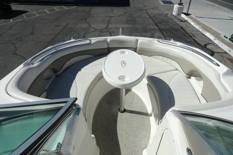 Slide: The Image of 2005 Kayot S245 boat interior with white seating and round table. - 18