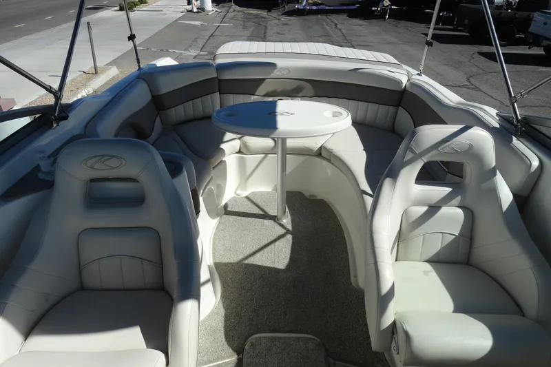 Slide: The Image of 2005 Kayot S245 boat interior with white seating and round table. - 22