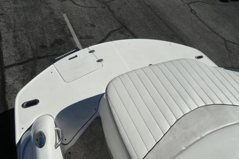 Slide: The Image of 2005 Kayot S245 boat deck with white upholstery and storage compartments. - 24