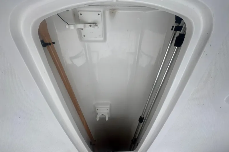 Slide: The Image of Storage compartment of 2024 Tahoe 210 S boat, featuring clean interior design. - 32