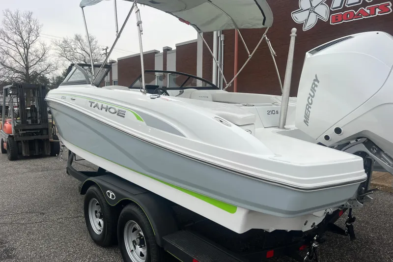 Slide: The Image of 2024 Tahoe 210 S boat on trailer, featuring sleek design and Mercury engine. - 5
