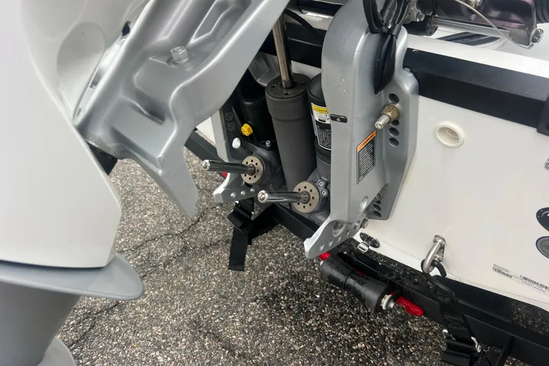 Slide: The Image of Close-up of 2024 Tahoe 210 S boat engine components and mounting details. - 9