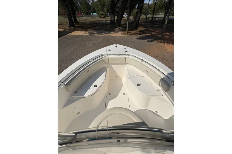 Slide: The Image of 2021 Cobia 237 Center Console boat interior with seating and storage compartments. - 15