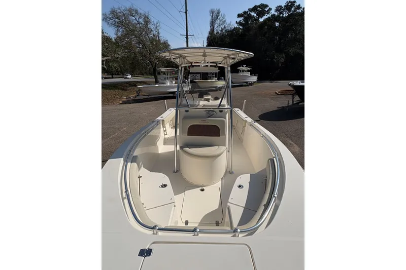 Slide: The Image of 2021 Cobia 237 Center Console boat with spacious deck and seating area. - 8
