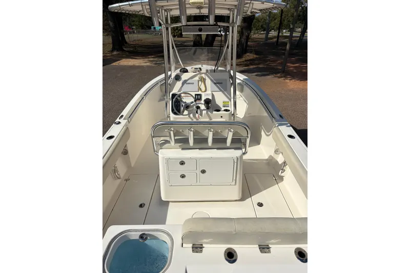 Slide: The Image of 2021 Cobia 237 Center Console boat interior with helm and seating area. - 9
