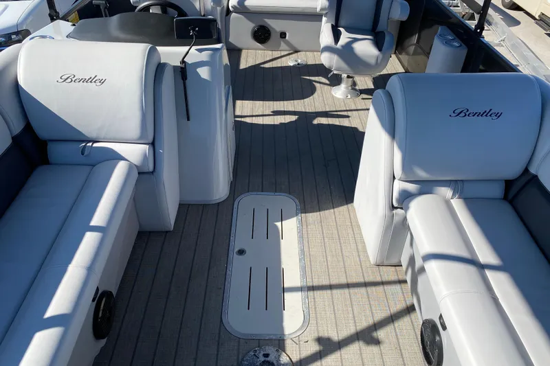 Slide: The Image of 2024 Bentley Pontoons Legacy Swingback interior with luxurious seating and modern design. - 10