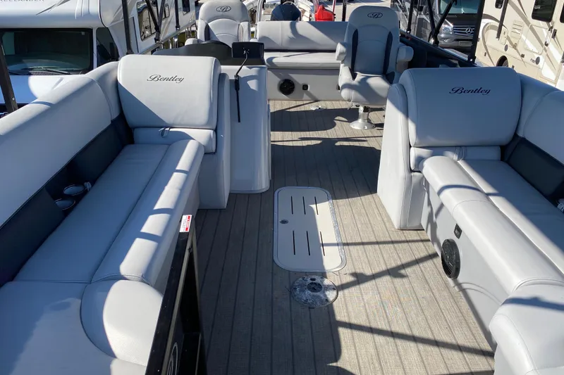 Slide: The Image of 2024 Bentley Pontoons Legacy Swingback interior with luxurious seating and modern design. - 12