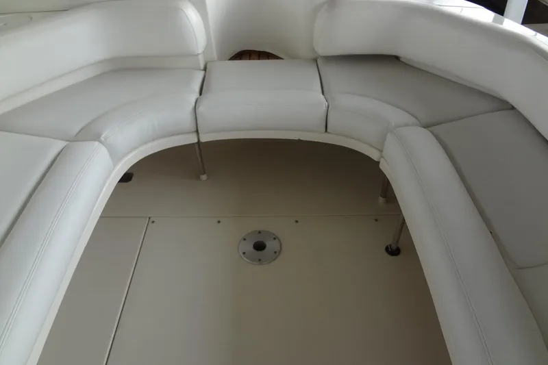 Slide: The Image of 2001 Sea Ray 380 Sundancer interior with white curved seating. - 17