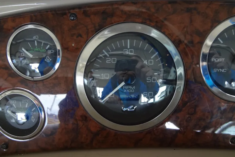 Slide: The Image of Dashboard gauges of a 2001 Sea Ray 380 Sundancer boat. - 24