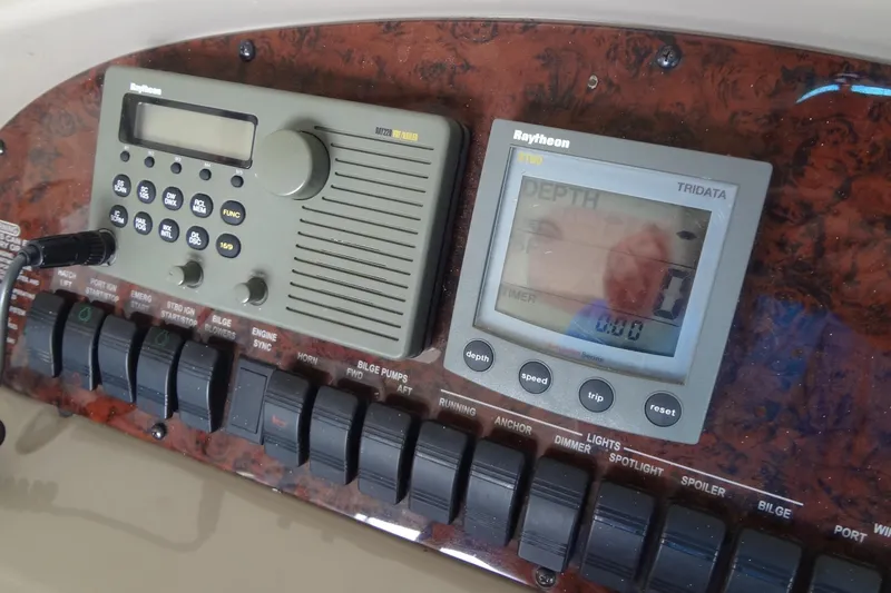 Slide: The Image of Control panel of a 2001 Sea Ray 380 Sundancer with navigation and depth instruments. - 26