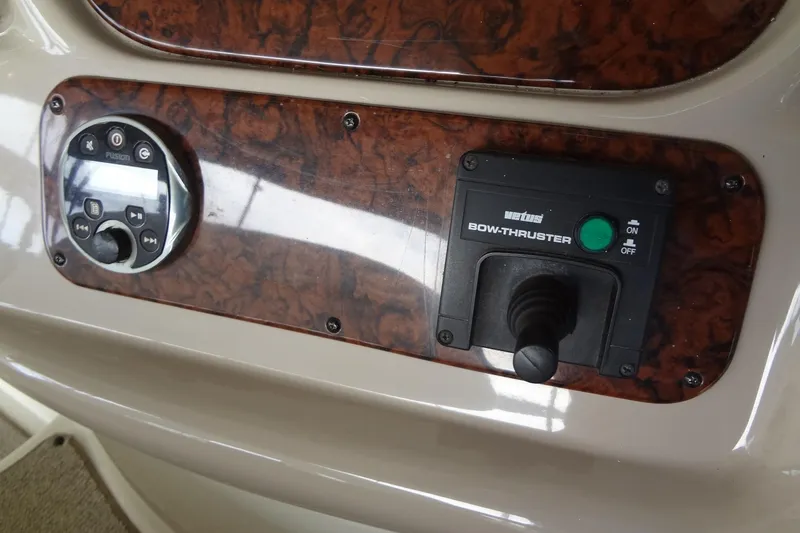 Slide: The Image of Control panel of a 2001 Sea Ray 380 Sundancer with bow thruster and audio system. - 27