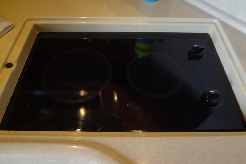 Slide: The Image of Built-in stovetop on 2001 Sea Ray 380 Sundancer yacht kitchen. - 32