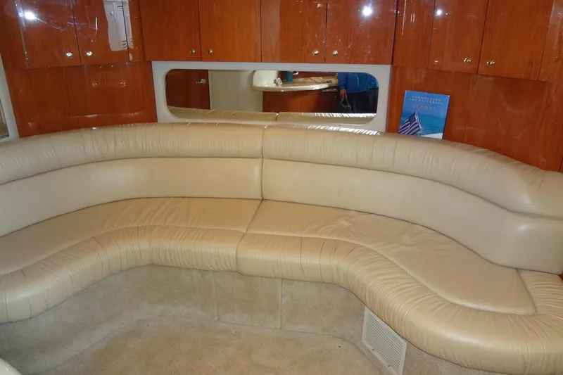Slide: The Image of Luxurious interior of 2001 Sea Ray 380 Sundancer with beige leather seating. - 38