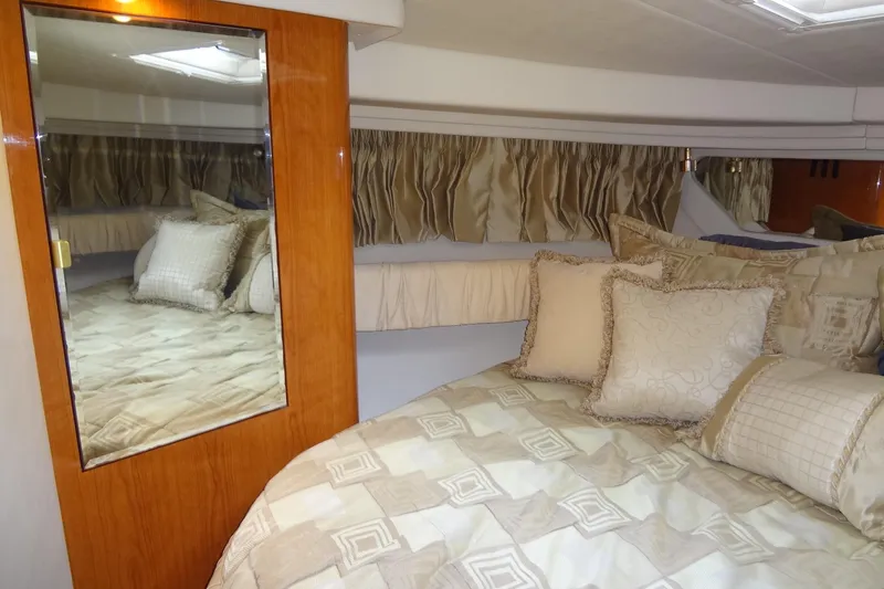Slide: The Image of Luxurious cabin interior of 2001 Sea Ray 380 Sundancer yacht with elegant bedding. - 44