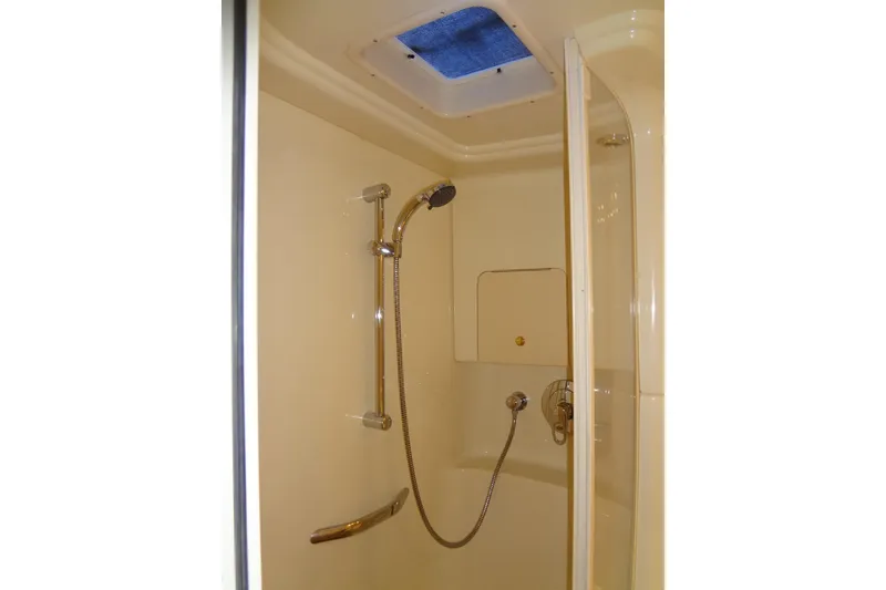 Slide: The Image of Shower area in 2001 Sea Ray 380 Sundancer yacht, featuring a sleek design and modern fixtures. - 48