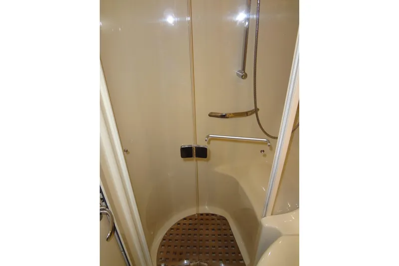Slide: The Image of Shower area in 2001 Sea Ray 380 Sundancer yacht, featuring sleek design and modern fixtures. - 49