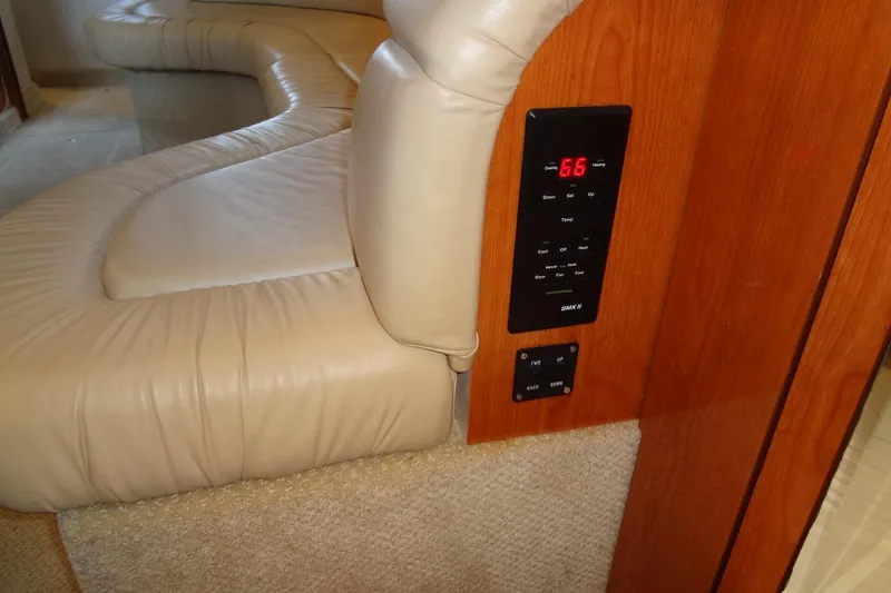 Slide: The Image of Interior of 2001 Sea Ray 380 Sundancer with beige leather seating and digital control panel. - 51