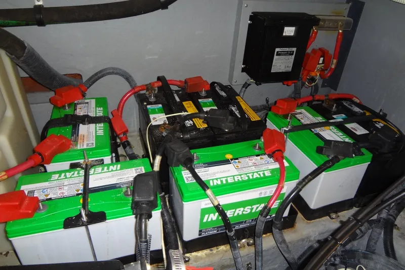 Slide: The Image of Batteries in a 2001 Sea Ray 380 Sundancer boat engine compartment. - 56