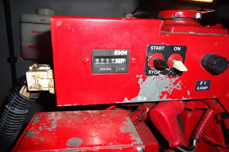 Slide: The Image of Control panel of a 2001 Sea Ray 380 Sundancer with hour meter and switches. - 60