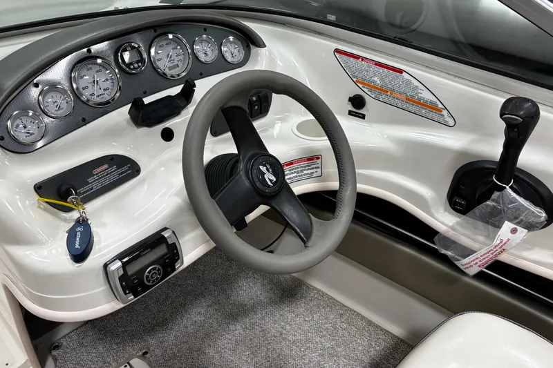 Slide: The Image of 2004 Sea Ray 185 Bow Rider dashboard with steering wheel and instrument panel. - 20