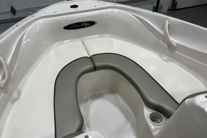Slide: The Image of 2004 Sea Ray 185 Bow Rider interior with white and gray seating. - 23