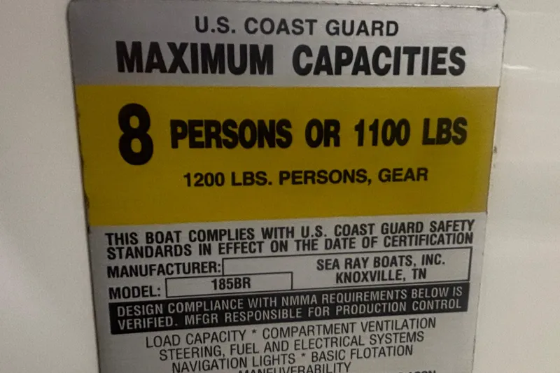 Slide: The Image of 2004 Sea Ray 185 Bow Rider capacity label, 8 persons or 1100 lbs, U.S. Coast Guard compliant. - 24