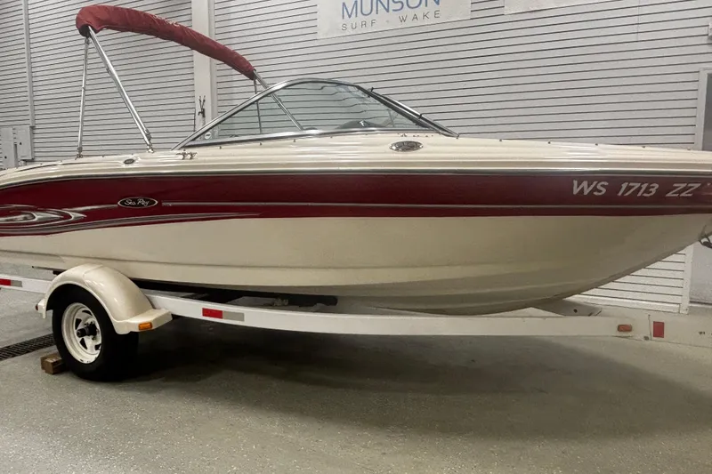 Slide: The Image of 2004 Sea Ray 185 Bow Rider boat on trailer in indoor storage. - 3