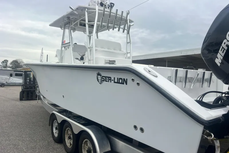 Slide: The Image of 2022 Sea-Lion 34 TE boat with triple-axle trailer and Mercury outboard engine. - 10